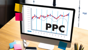 A computer with a graph on the screen and large text that reads “PPC”.