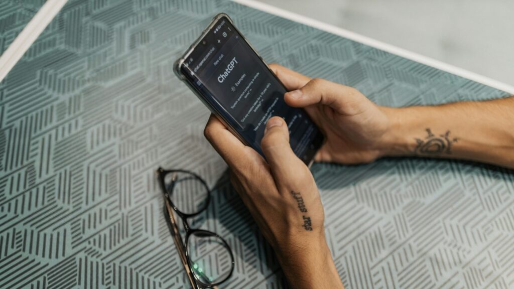 A person uses their phone to search up something using AI.