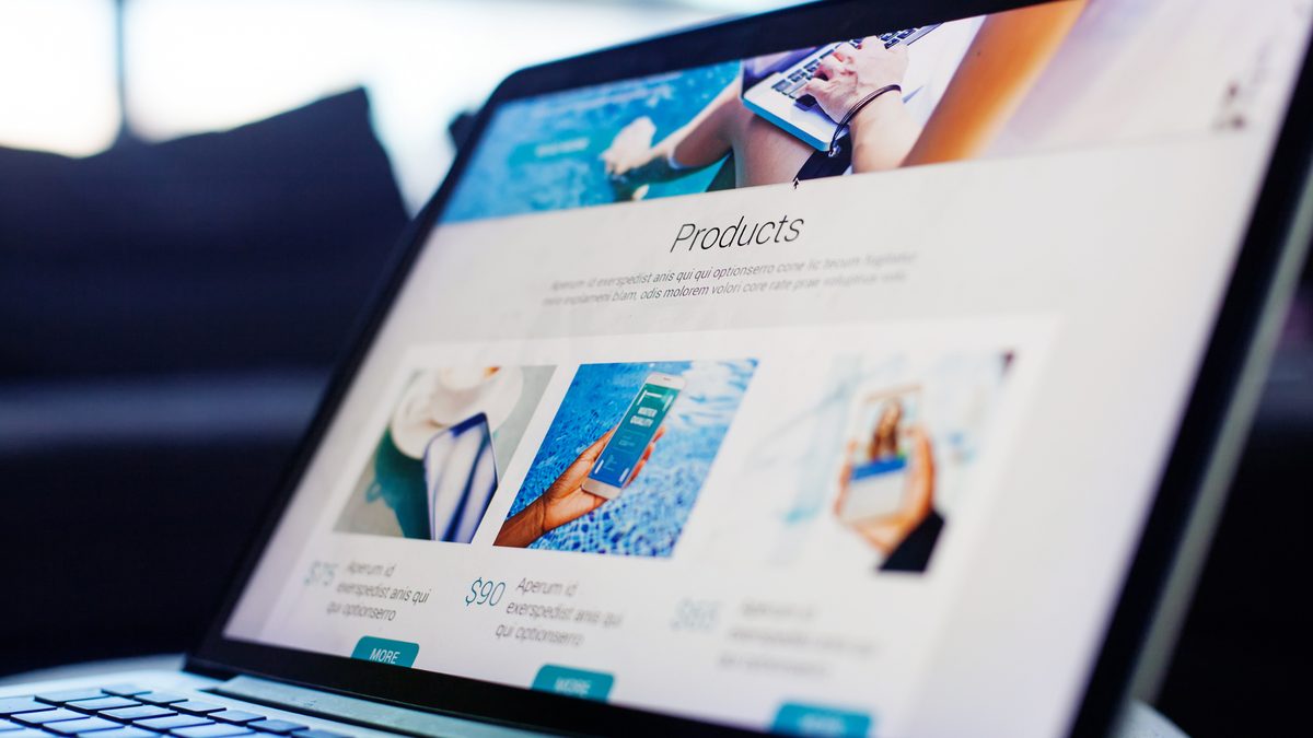 Close-up of a laptop screen showing a business website products page.
